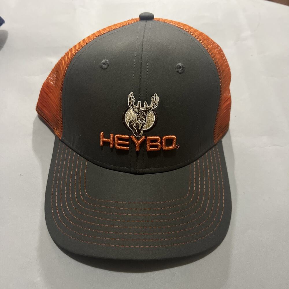 a Heybo Outdoor Hunting Brown with Orange Mesh Adjustable Trucker Hat.